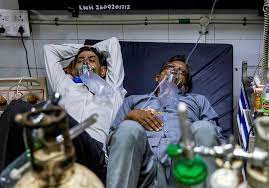 Two to a bed in Delhi hospital as India's COVID crisis spirals - The Economic Times
